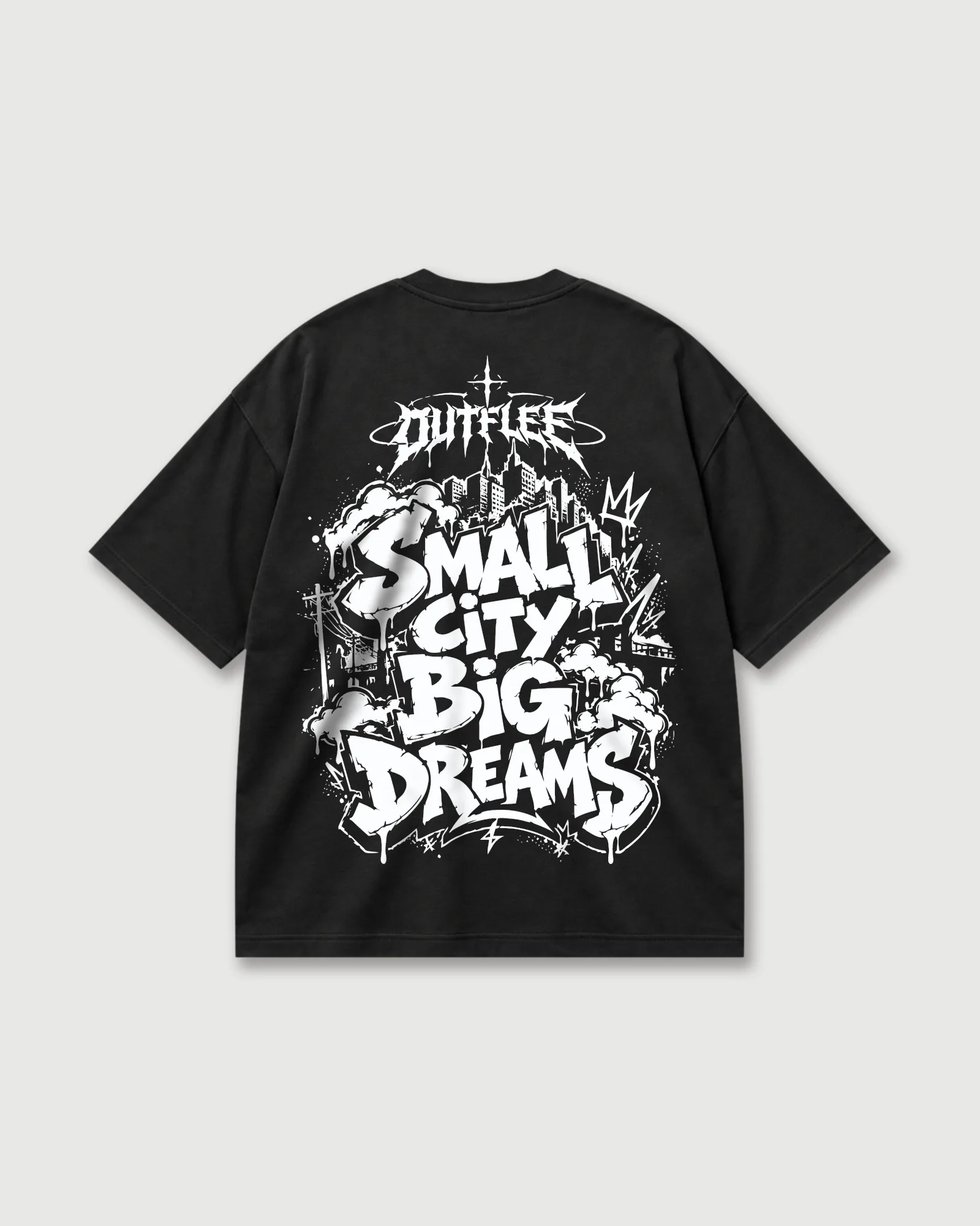 Back of black Outflee Small City Big Dreams drop shoulder T-shirt with bold white graffiti lettering and urban city artwork.