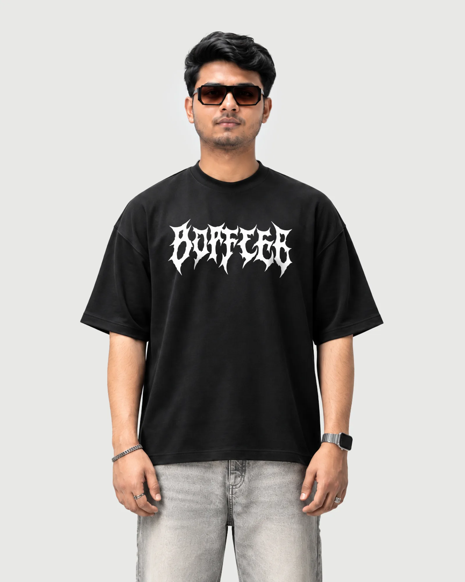 Model wearing the black Outflee Shadow Ronin drop shoulder T-shirt, front view showing the bold white gothic Outflee chest print.